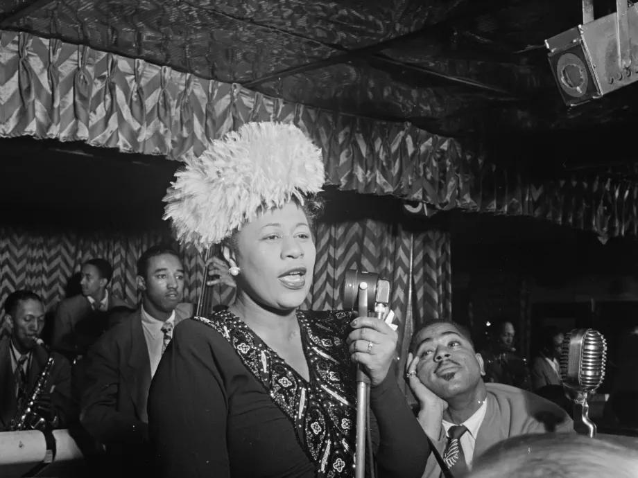 Black-and-white portrait of Ella Fitzgerald in performance